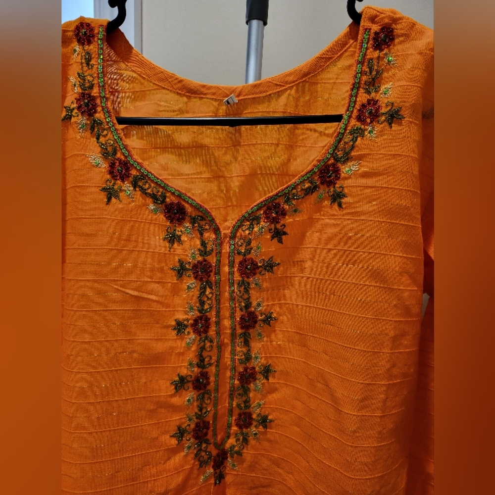 Brand new top with embroidered, sequences and beads work on front and sleeves